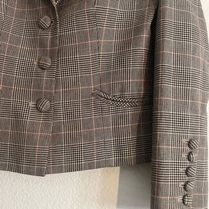 Plaid pattern 3 button Blazer, two front pockets, decorative buttons on sleeves.